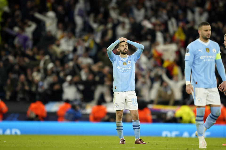 Manchester City's Bernardo Silva reacts after losing the Champions League quarterfinal second leg soccer match against Real Madrid at the Etihad Stadium in Manchester, England, Wednesday, April 17, 2024. (AP Photo/Dave Thompson)