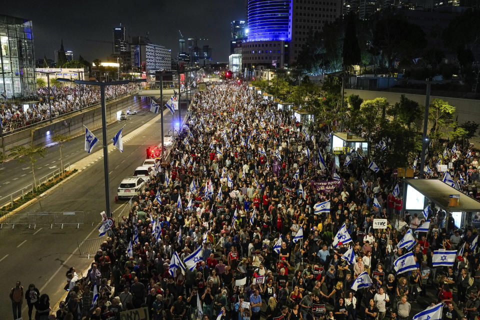 People protest against Israeli Prime Minister Benjamin Netanyahu's government and call for the release of hostages held in the Gaza Strip by the Hamas militant group in Tel Aviv, Israel, Saturday, April 27, 2024. (AP Photo/Ohad Zwigenberg)