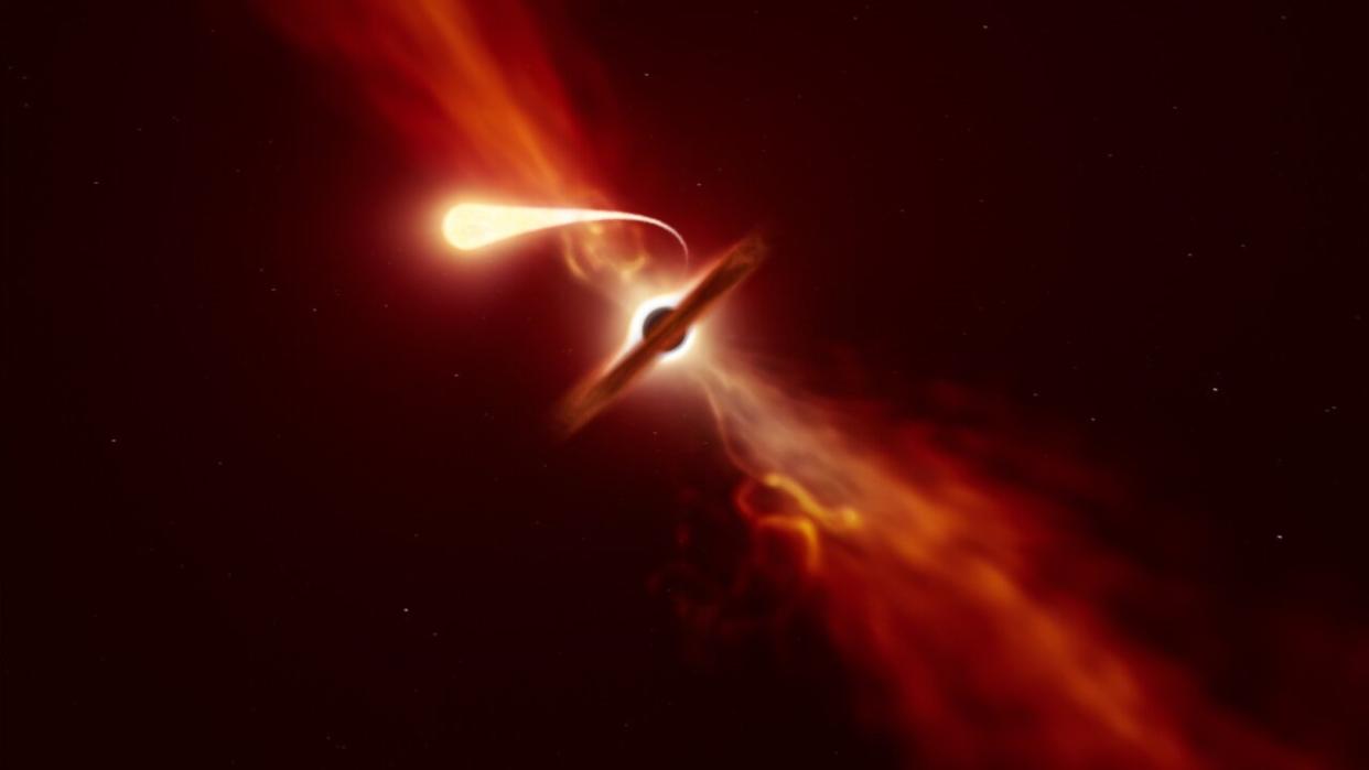  An artist's impression of a star (foreground) being disrupted as it passes close to a supermassive black hole. 