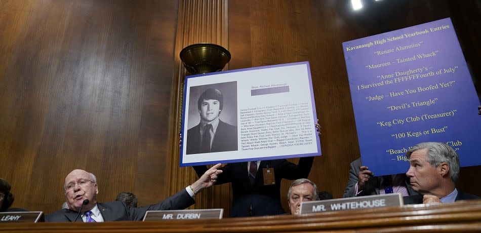 WASHINGTON, DC - SEPTEMBER 27: U.S. Sen. Patrick Leahy (D-VT) displays a high school yearbook page and quotes by U.S. Supreme Court nominee Brett Kavanaugh during testimony before the Senate Judiciary Committee at the Dirksen Senate Office Building on Capitol Hill September 27, 2018 in Washington, DC. (Photo by Andrew Harnik-Pool/Getty Images)