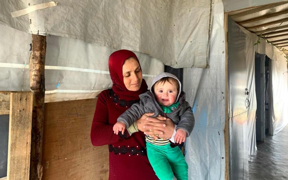 Nawaf's mother and baby sister: it takes two days work for Nawaf to earn enough to buy milk for his sister - Abbie Cheeseman