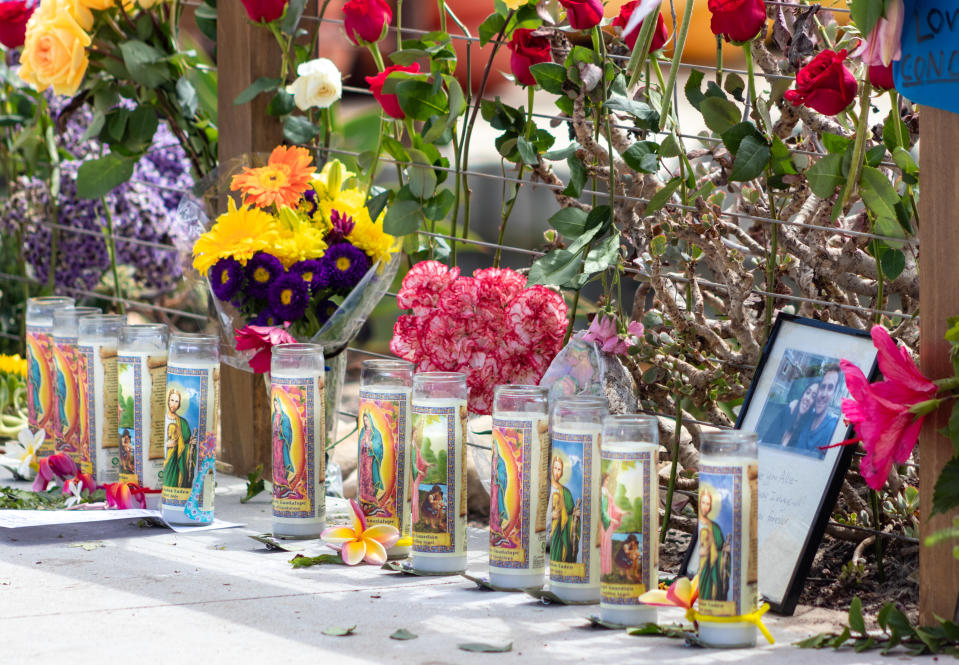 Mourners leave flowers and memorabilia at the Sea Landing dock home of the commercial dive boat Conception in Santa Barbara, California. 