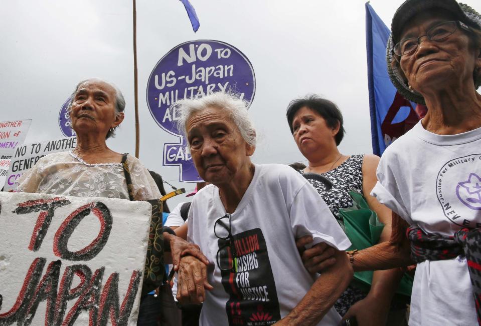 Alleged Filipino "comfort women" and their supporters gather for a rally outside the Japanese Embassy to protest the two-day visit of Japanese Prime Minister Shinzo Abe, Thursday, Jan. 12, 2017, in suburban Pasay city south of Manila, Philippines. The "comfort women," alleged forced by Japanese forces to be sex slaves during WWII, are calling on President Rodrigo Duterte to bring up their plight in his meeting with Prime Minister Abe. (AP Photo/Bullit Marquez)