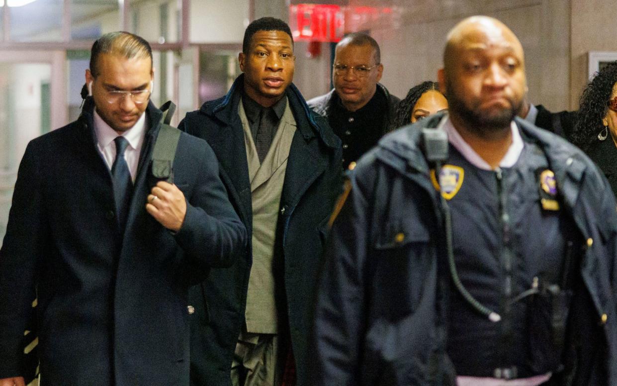 US actor Jonathan Majors (C) arrives to court as the jury deliberations continue in New York, New York, USA