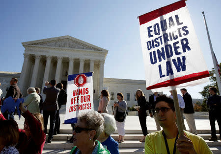 Demonstrators rally during oral arguments in Gill v. Whitford, a case about partisan gerrymandering in electoral districts, at the Supreme Court in Washington, U.S., October 3, 2017. REUTERS/Joshua Roberts