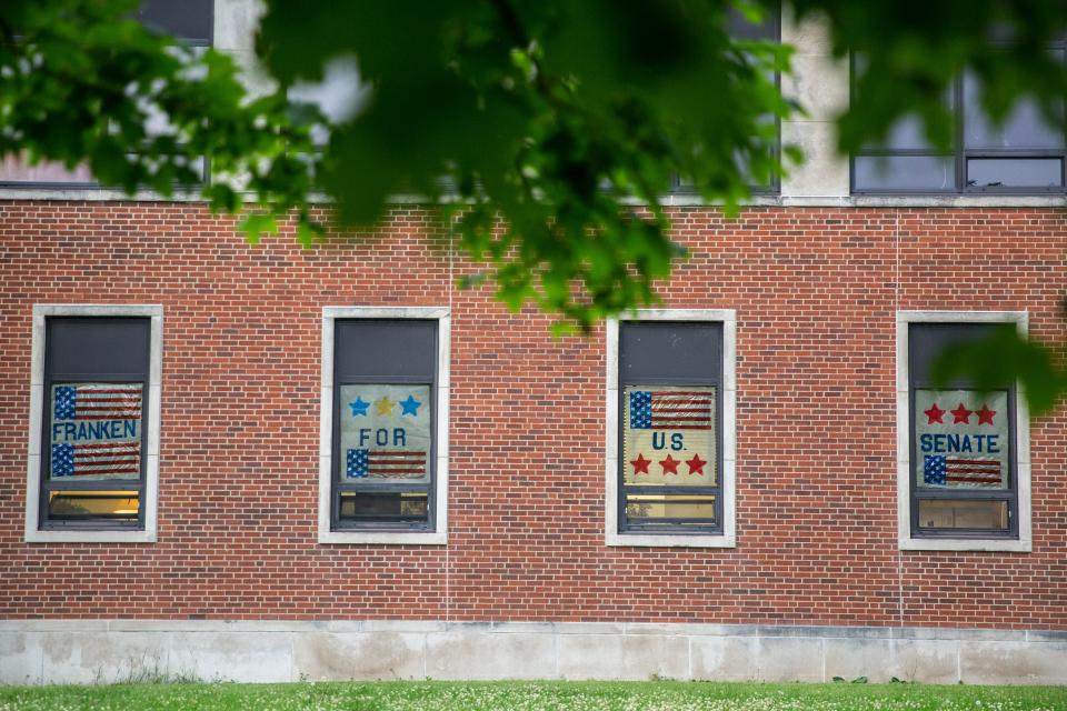 Campaign signs cover the windows at the election night gathering for Democratic candidate for U.S. Senate Mike Franken, retired Navy admiral from Sioux City, on Tuesday, June 7, 2022, at Franklin Junior High, in Des Moines. 