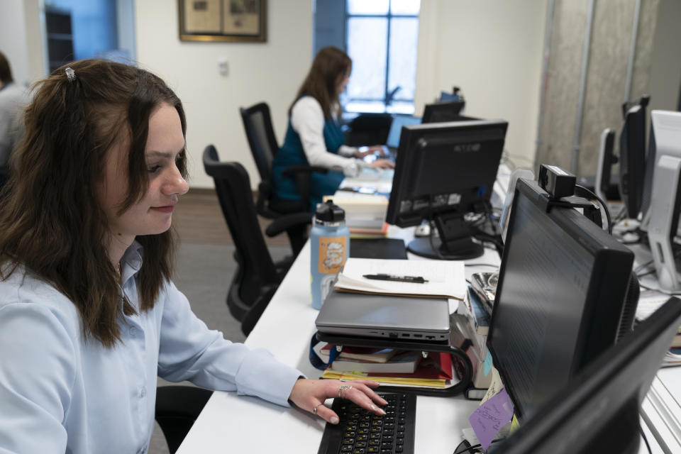 Karolina Hird, a Russia Analyst, works at her desk at the Institute for the Study of War, Wednesday, Jan. 11, 2023, in Washington. (AP Photo/Alex Brandon)