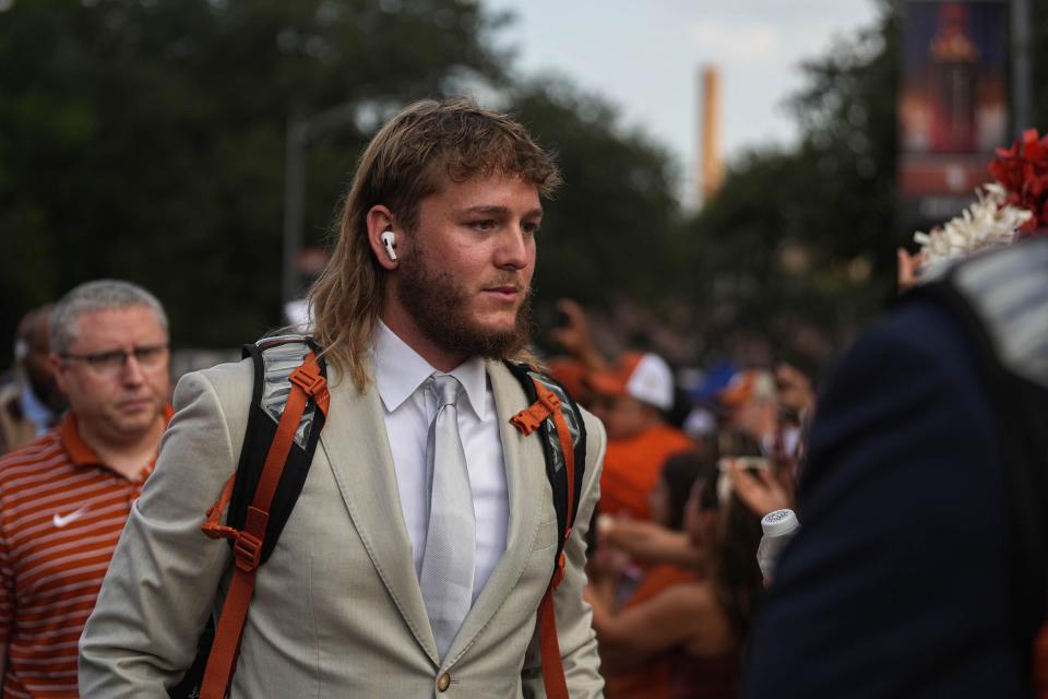 Texas Longhorns quarterback Quinn Ewers and his teammates walk into the stadium for the game against Alabama at Royal Memorial Stadium on Sep. 10, 2022.