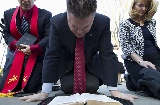 Pastor Mark Morrow of the CrossWalk Community Church in Williamsburg, Va, reads from his bible.