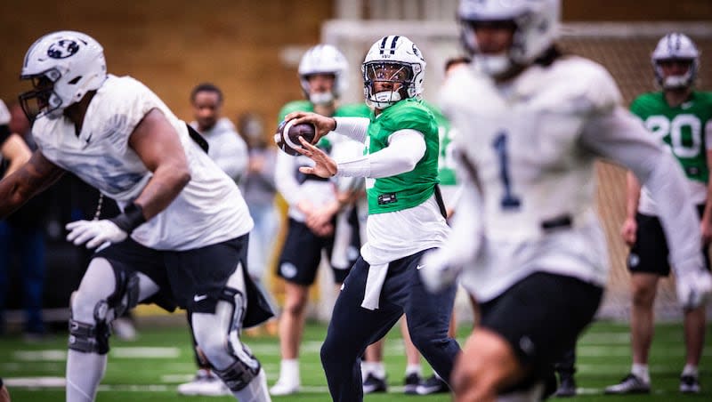 BYU's offense runs a play during spring practice March, 30, 2024, at the indoor practice facility.