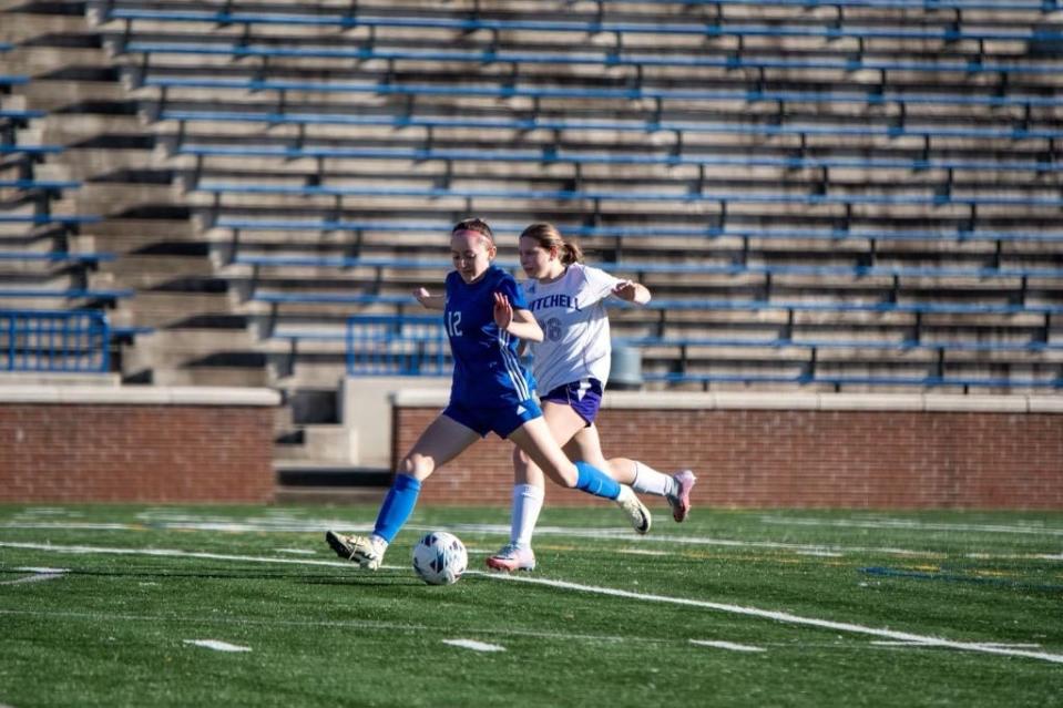Amber Hernandez takes the ball up the field in Madison's season-opening win against Mitchell March 11. Hernandez leads the team in goals and assists.