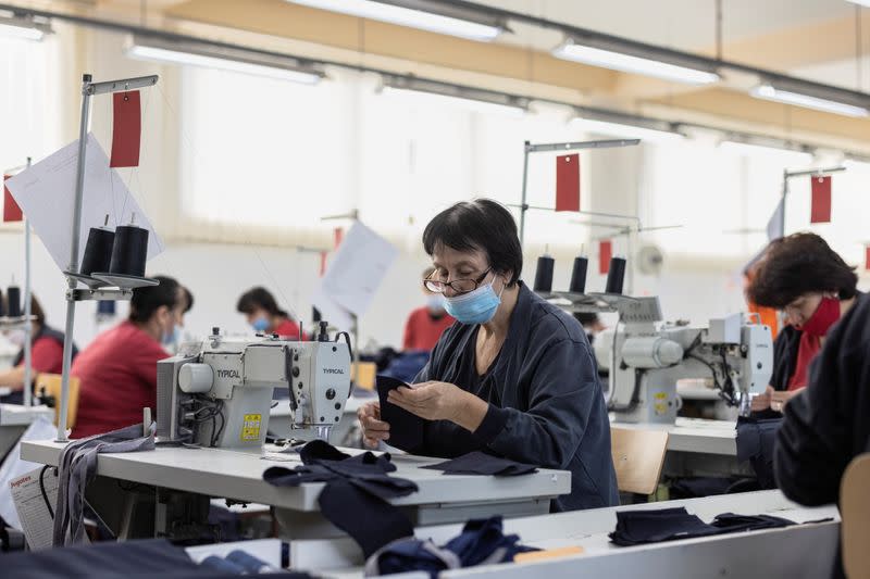 Workers sew cloths at the Jugotex textile factory in Smederevo