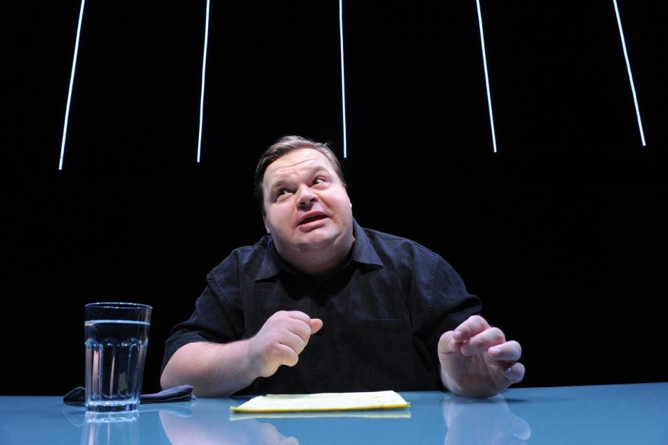 In this undated image released by The Public Theater, Mike Daisey is shown in a scene from "The Agony and The Ecstasy of Steve Jobs," in New York. Daisey, whose latest show has been being credited with sparking probes into how Apple's high-tech devices are made, is finding himself under fire for distorting the truth. The public radio show This American Life retracted a story Friday, March 16, 2012, that it broadcast in January about what Daisey said he saw while visiting a factory in China where iPads and iPhones are made. (AP Photo/The Public Theater, Stan Barouh)