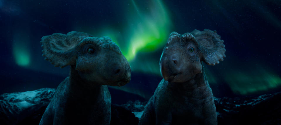 In this image released by 20th Century Fox, Patchi, left, with another Pachyrhinosaurus named Juniper in a scene from the film, "Walking With Dinosaurs." (AP Photo/20th Century Fox)