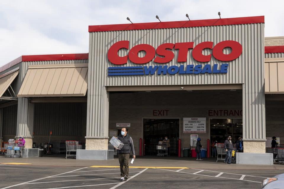 A person wearing a protective mask exits a Costco store in Richmond, California, U.S., on Wednesday, March 3, 2021. Costco Wholesale Corp. is schedule to release earnings figures on March 4. Photographer: David Paul Morris/Bloomberg via Getty Images