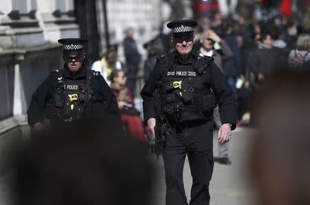 Armed police patrol the streets following the attack in Westminster earlier in the week, in central London, Britain March 26, 2017. REUTERS/Neil Hall