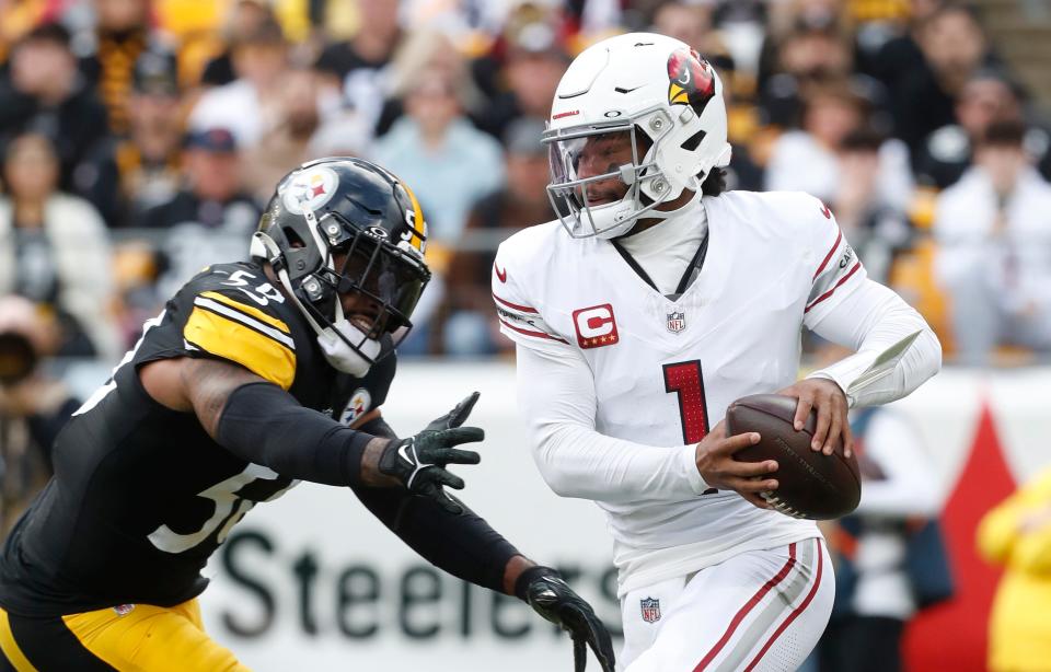 Arizona Cardinals quarterback Kyler Murray (1) escapes the pass rush of Pittsburgh Steelers linebacker Elandon Roberts (50) during the first quarter at Acrisure Stadium in Pittsburgh on Dec. 3, 2023.