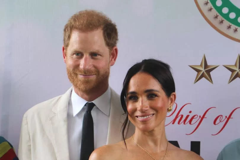 Meghan Markle wore a diamond cross necklace that once belonged to Princess Diana during her Nigeria tour with Prince Harry