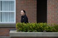 Huawei CFO Meng leaves her home to attend her extradition hearing in Vancouver