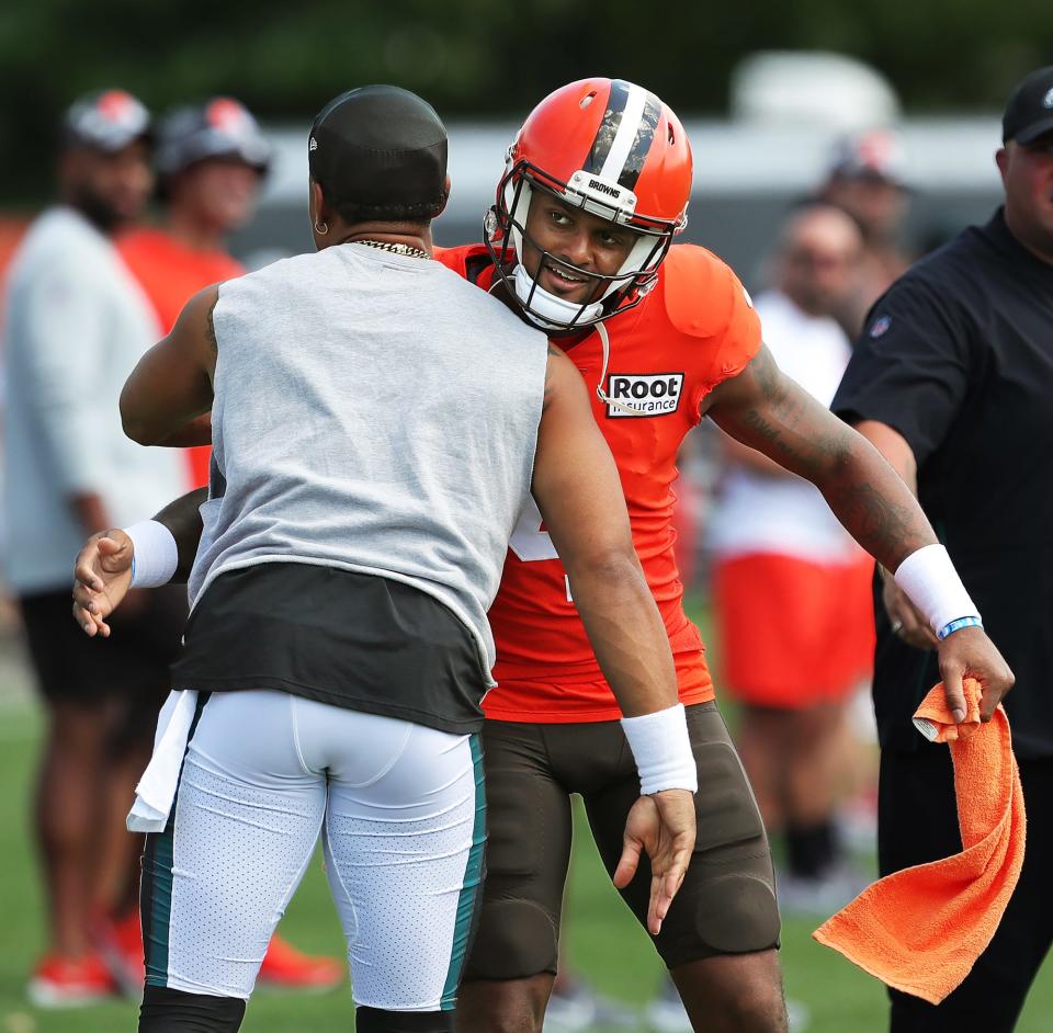 Cleveland Browns quarterback Deshaun Watson, facing, hugs Philadelphia Eagles quarterback Jalen Hurts before the teams' joint practice at the Browns training facility in Berea last year.