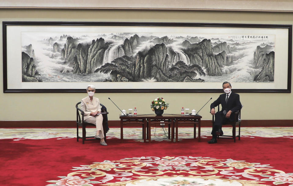 In this photo provided by the U.S. Department of State, U.S. Deputy Secretary of State Wendy Sherman, left, and Chinese Foreign Minister Wang Yi sit together in Tianjin, China, Monday, July 26, 2021.  / Credit: / AP