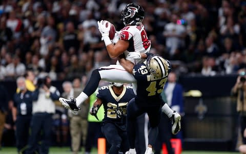 Atlanta Falcons tight end Austin Hooper (81) pulls in a touchdown pass over New Orleans Saints free safety Marcus Williams (43) and cornerback Eli Apple (25) in the first half of an NFL football game in New Orleans - Credit: AP