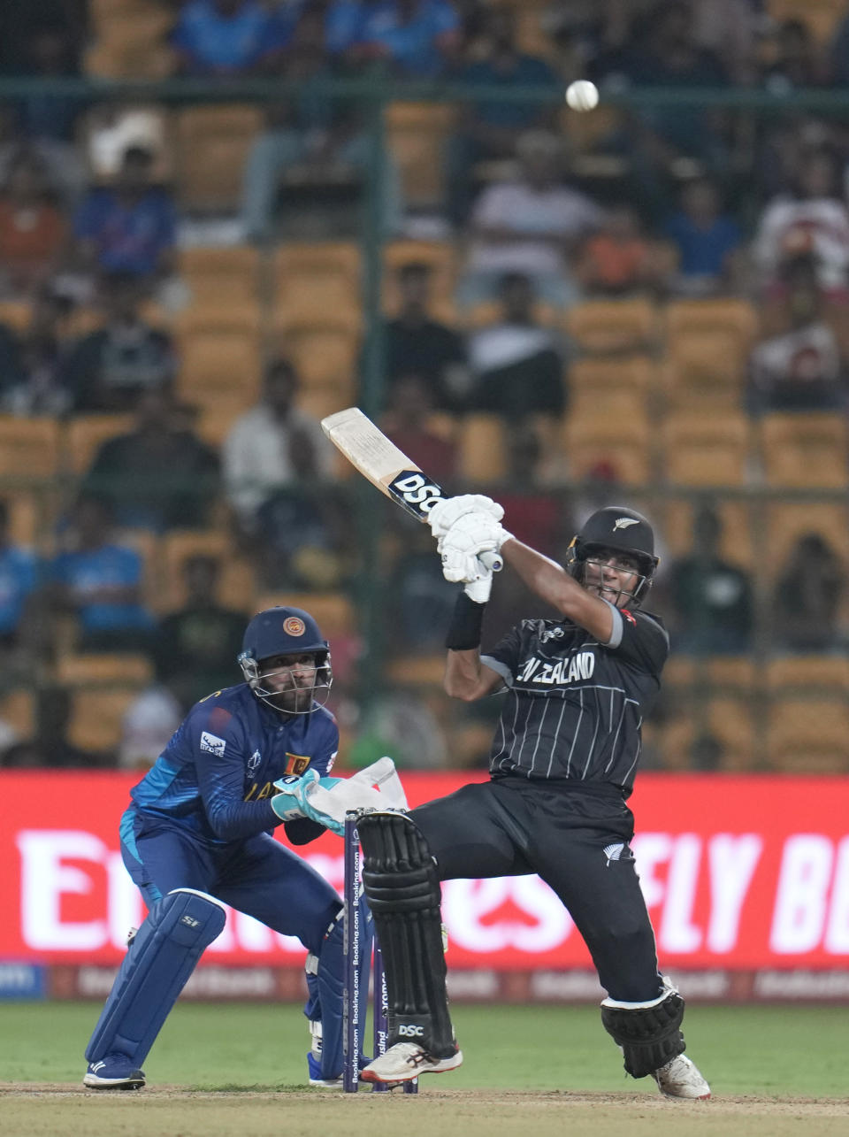 New Zealand's Rachin Ravindra plays a shot during the ICC Men's Cricket World Cup match between New Zealand and Sri Lanka in Bengaluru, India, Thursday, Nov. 9, 2023. (AP Photo/Aijaz Rahi)