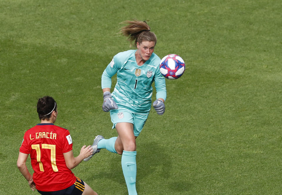 United States goalkeeper Alyssa Naeher, right, makes a save in front of Spain's Lucia Garcia during the Women's World Cup round of 16 soccer match between Spain and United States at Stade Auguste-Delaune in Reims, France, Monday, June 24, 2019. (AP Photo/Thibault Camus)