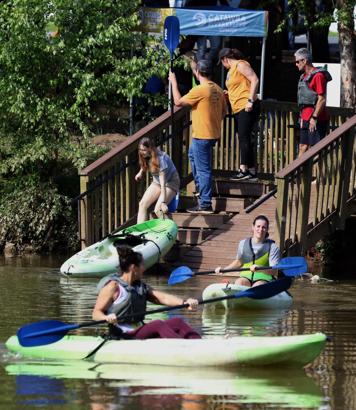 People take to the Catawba River in kayaks during the Goat Island Games held Saturday morning, May 6, 2023, on Goat Island in Cramerton.