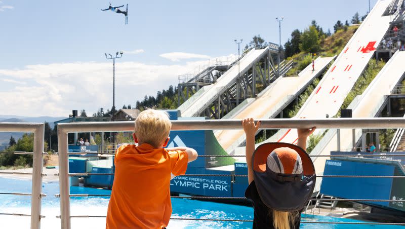Wyatt, left, and Victoria watch athletes compete at the 2023 U.S. Freestyle Ultimate Airwave Competition at the Utah Olympic Park in Park City on Aug. 26, 2023.