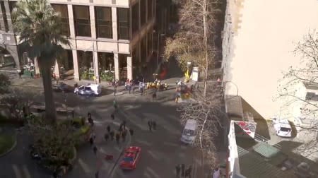 An aerial view shows security officers standing around a barricaded area, following reports of a stabbing incident in the central business district of Sydney