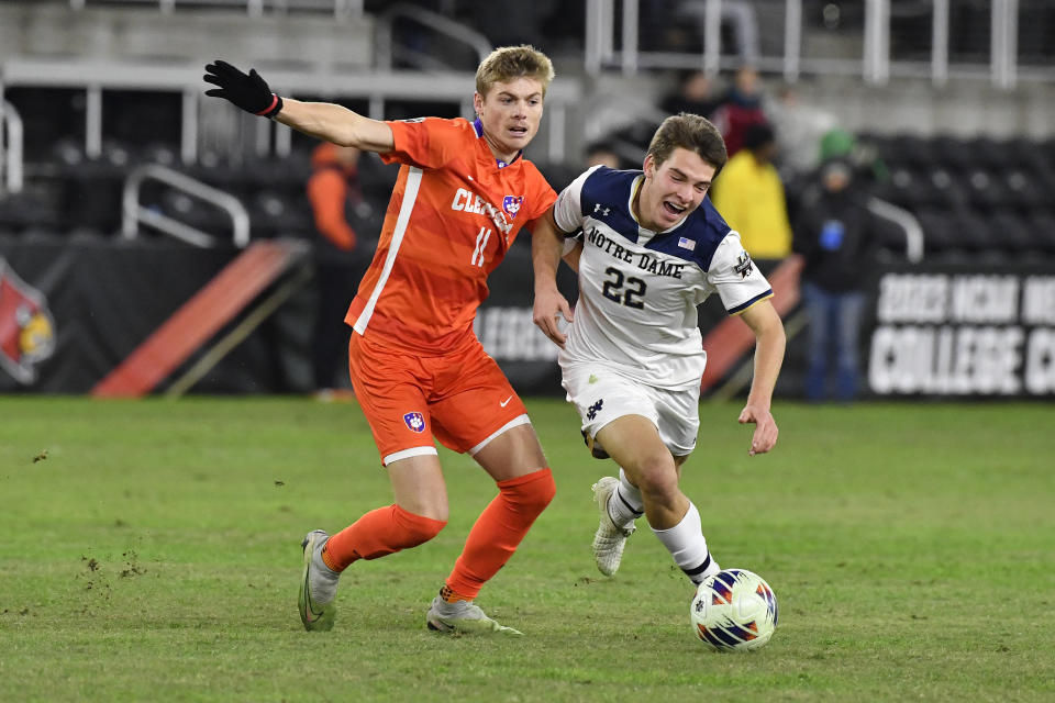 Clemson midfielder Brandon Parrish (11) battles Notre Dame midfielder Nolan Spicer (22) for possession during the second half of the NCAA college soccer tournament championship game in Louisville, Ky., Monday, Dec. 11, 2023. (AP Photo/Timothy D. Easley)