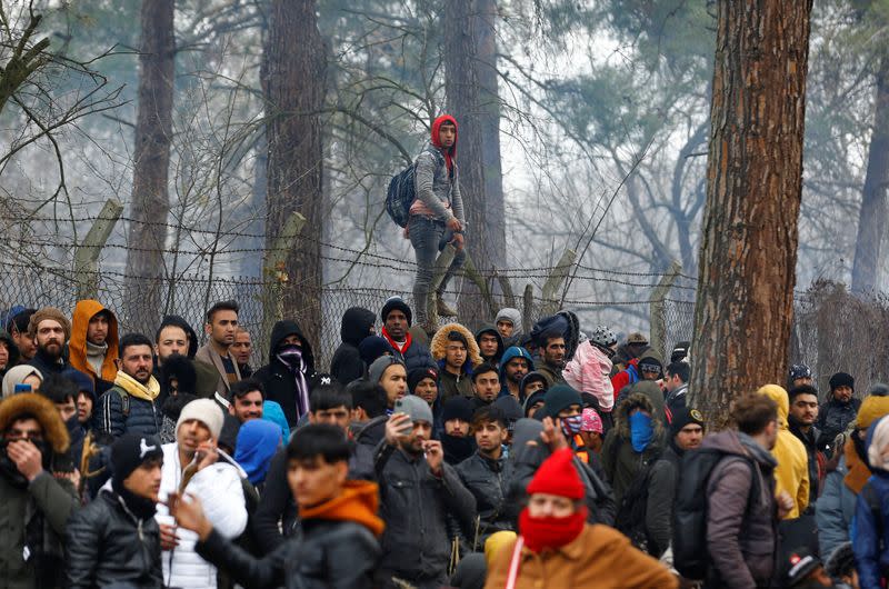 Migrants gather at the Turkey's Pazarkule border crossing with Greece's Kastanies, in Edirne