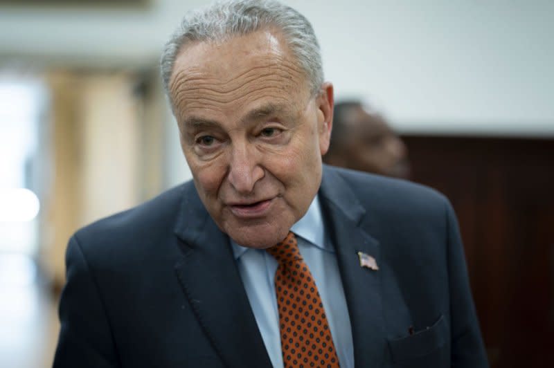 Senate Majority Leader Chuck Schumer, D-N.Y., speaks to the media about passing a short-term stopgap to avert a government shutdown in the Senate subway at the U.S. Capitol on Thursday. Photo by Bonnie Cash/UPI