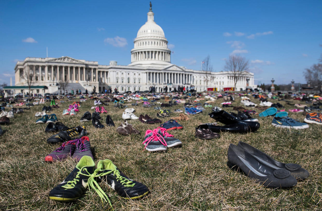 The lawn outside the Capitol is covered with 7,000 pairs of empty shoes  (Saul Loeb / AFP via Getty Images file)