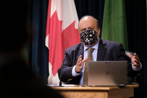 Experts say Saskatchewan's chief medical health oficer Dr. Saqib Shahab, pictured, can and must issue COVID-19 public health orders immediately to protect the public, even if Premier Scott Moe disagrees. (The Canadian Press - image credit)