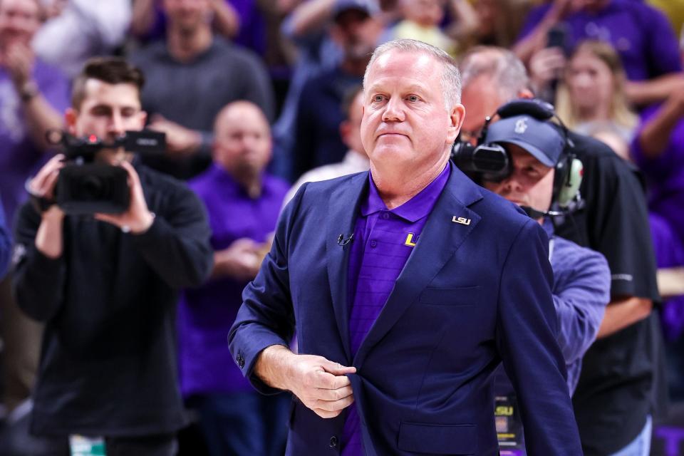 Dec 1, 2021; Baton Rouge, Louisiana, USA;  LSU Tigers football head coach Brian Kelly speaks to the fans at halftime between the LSU Tigers and the Ohio Bobcats  at Pete Maravich Assembly Center. Mandatory Credit: Stephen Lew-USA TODAY Sports