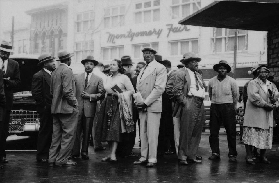 Leaders of the Montgomery bus boycott stand at a bus stop and wait for a bus following the end of the year-long protest, Montgomery, Alabama, December 26, 1956. Among them are American Civil Rights Leader Reverend Martin Luther King Jr. (1929 - 1968) (fourth from left), his wife, fellow Civil Rights activist Coretta Scott King (fifth from left), and Reverend Ralph Abernathy (1926 - 1990) (visible over the shoulder of the tall man in the center).