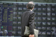 A man looks at an electronic stock board supposedly showing Japan's Nikkei 225 index at a securities firm Thursday, Oct. 1, 2020, in Tokyo. Trading on the Tokyo Stock Exchange was suspended Thursday because of a problem in the system for relaying market information. Most other Asian markets were closed for national holidays. (AP Photo/Eugene Hoshiko)