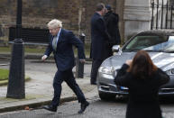 Britain's Prime Minister Boris Johnson arrives back at 10 Downing Street in London, Friday, Dec. 13, 2019 after meeting Queen Elizabeth II to seek her approval to form a new government. Prime Minister Boris Johnson's Conservative Party has won a solid majority of seats in Britain's Parliament — a decisive outcome to a Brexit-dominated election that should allow Johnson to fulfill his plan to take the U.K. out of the European Union next month. (AP Photo/Thanassis Stavrakis)