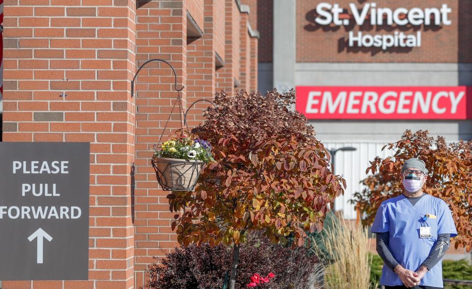 Dr. Manar Alshahrouri, a critical care doctor, stands outside HSHS St. Vincent, one of two Green Bay hospitals where he treats COVID-19 patients.