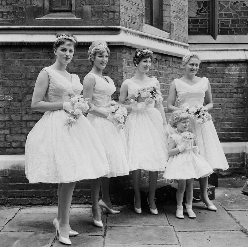 <p>Tulle, tulle, and more tulle was the look of the mid- to late '50s. While hems on bridesmaids dresses became shorter during this time, but that didn't mean they lost their wide brimmed look. </p>