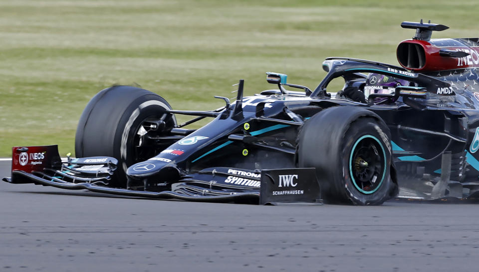 The punctured tyre of Mercedes' British driver Lewis Hamilton punctures is pictured as he goes on to win the Formula One British Grand Prix at the Silverstone motor racing circuit in Silverstone, central England on August 2, 2020. - Lewis Hamilton survived a dramatic finale to win the British Grand Prix on Sunday, just making it across the line on three tyres to beat a fast closing Max Verstappen on Red Bull. The defending world champion claimed his seventh British Grand Prix win as Ferarri's Charles Leclerc came third and Daniel Ricciardo of Renault fourth. (Photo by ANDREW BOYERS / POOL / AFP) (Photo by ANDREW BOYERS/POOL/AFP via Getty Images)