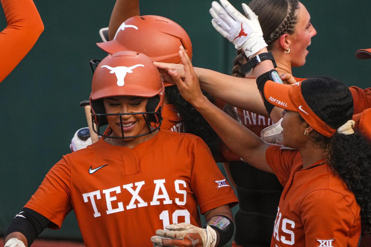 Teammates celebrate a home run hit by Texas' Mia Scott during their April 26 game against Iowa State at McCombs Field. The Longhorns carry the No. 1 seed into this week's Big 12 Tournament as well as the No. 1 spot in all three major college softball polls.