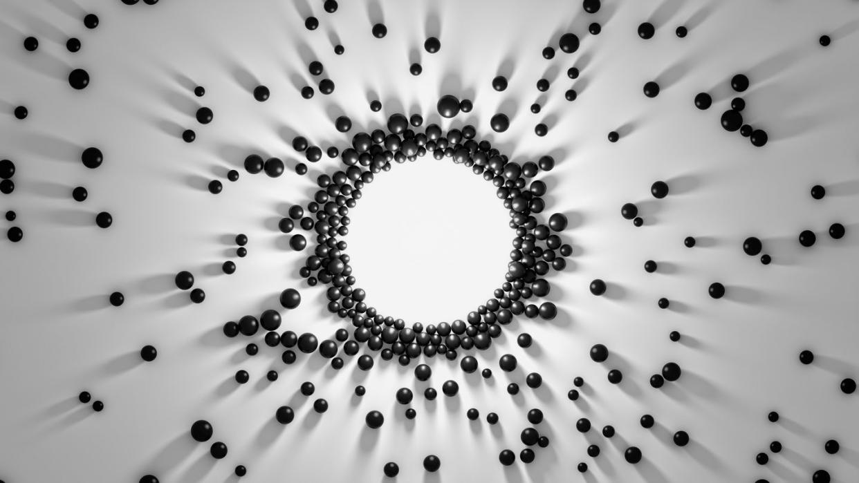 gathering of black spheres to the center light attraction of objects with long shadows 3d abstract concept of collaboration magnetic attraction of objects to central formation render