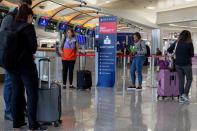 FILE PHOTO: Passengers wait for the flights to resume at Hartsfield-Jackson Atlanta International Airport in Atlanta