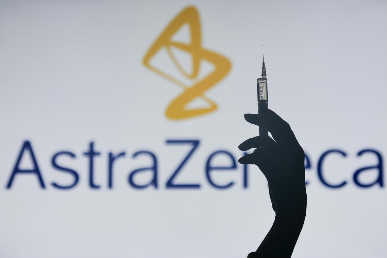 An illustrative image of a hand holding a medical syringe in front of the University of Oxford AstraZeneca logos displayed on a screen.
On Monday, February 1, 2021, in Dublin, Ireland. (Photo by Artur Widak/NurPhoto via Getty Images)