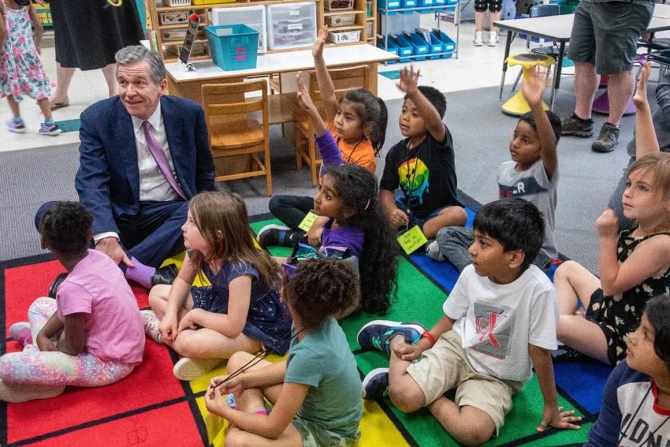 Gov. Roy Cooper visits a kindergarten class while touring Washington Magnet Elementary School in Raleigh on May 23, 2023.