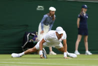 Czech Republic's Tomas Berdych slips in his match against Slovakia's Martin Klizan during day Two of the Wimbledon Championships at The All England Lawn Tennis and Croquet Club, Wimbledon.