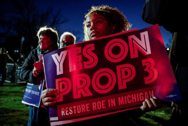 PHOTO: Michigan Jaelynn Smith, a freshman at Michigan State University, holds a sign in support of Proposal 3, a ballot measure to codify abortion rights, at a 'get out the vote' rally at MSU in East Lansing, Mich., Nov. 7, 2022. (Evelyn Hockstein/Reuters)